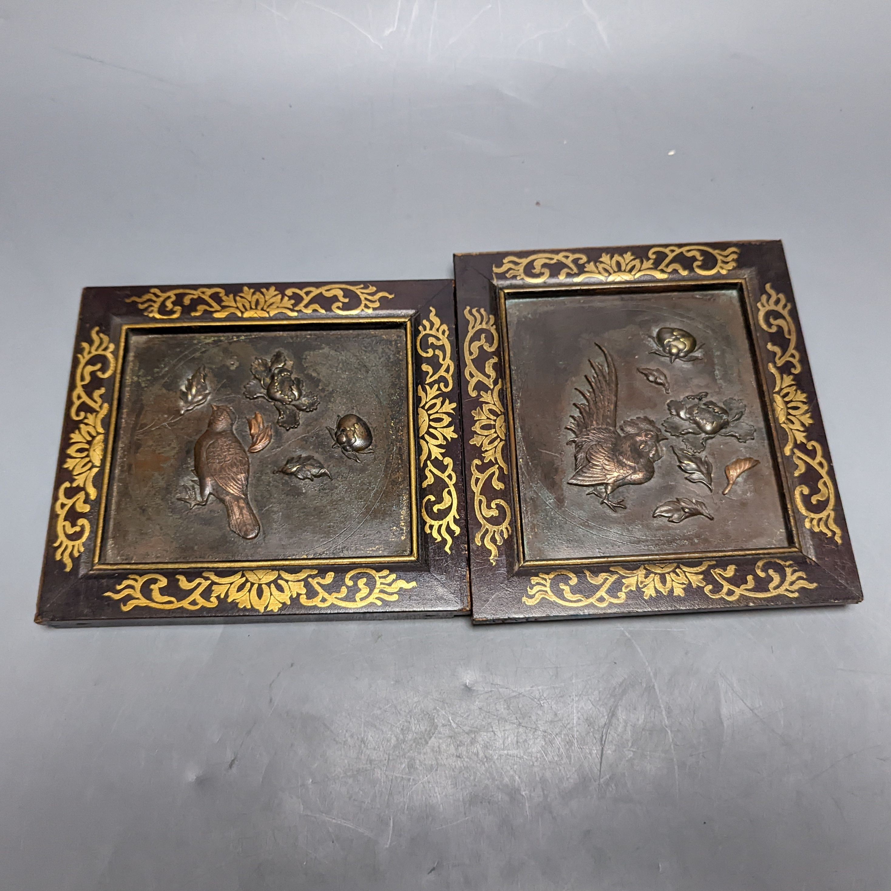 A pair of Japanese mixed metal chicken panels, in gilded wood frames, 17cm. high